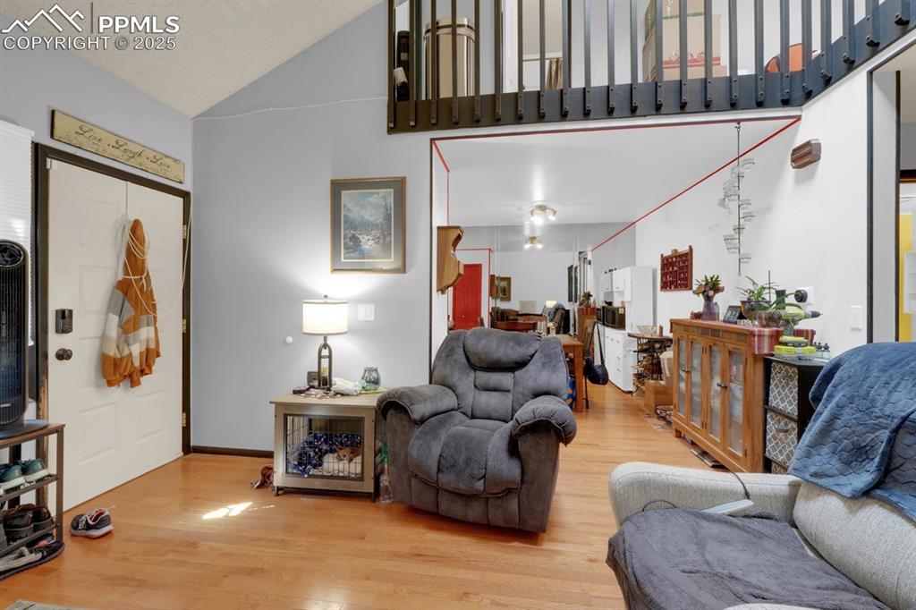 Image 7 of 27: Living Area flows to Dining Area and Kitchen