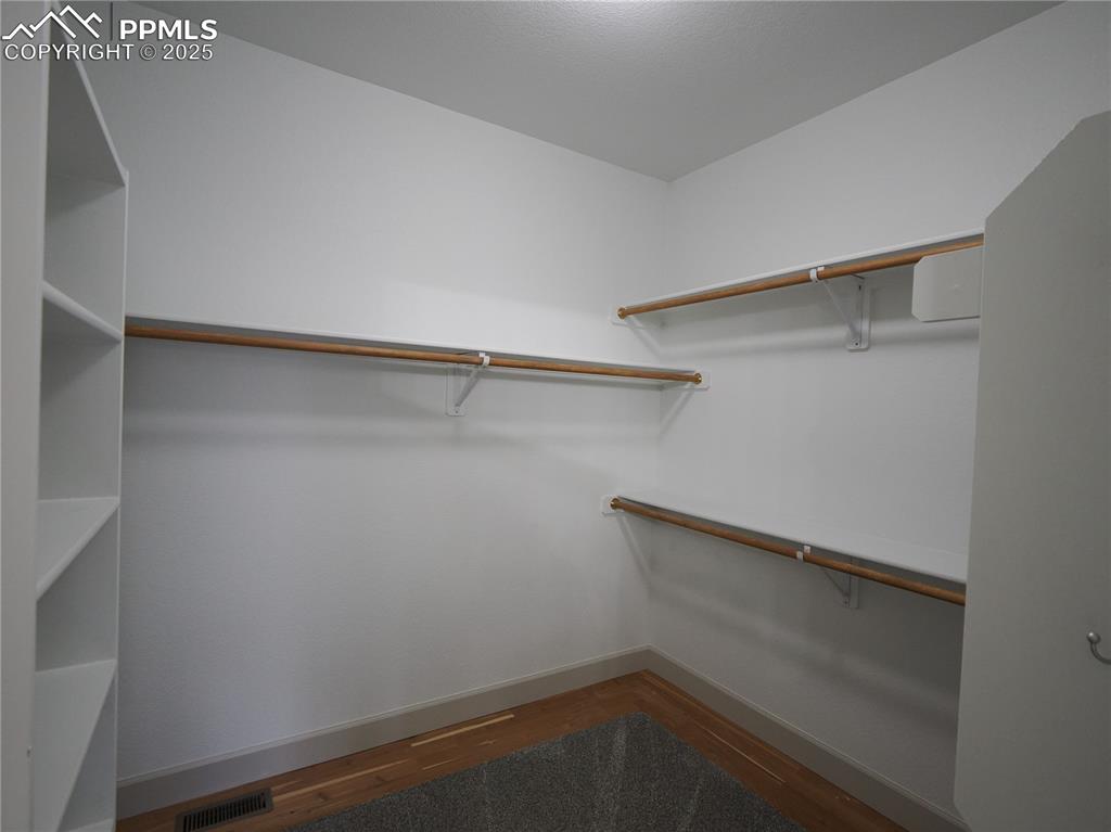 Image 26 of 49: Primary walk in closet 