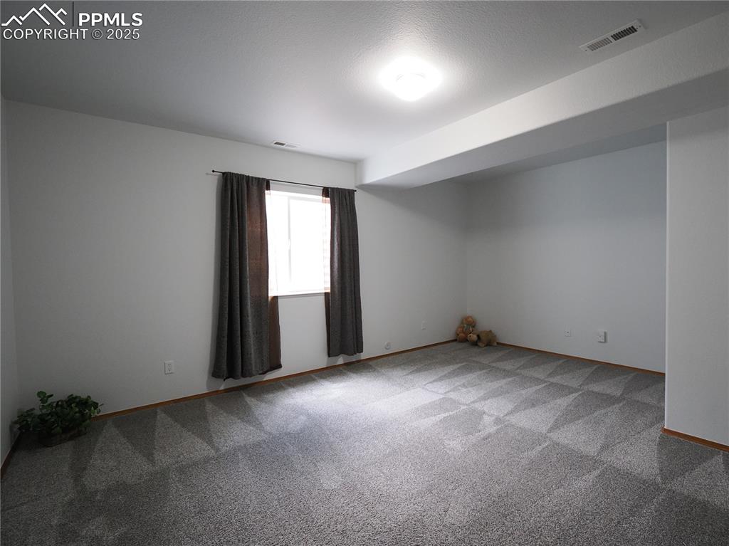Image 31 of 49: SE basement bedroom 