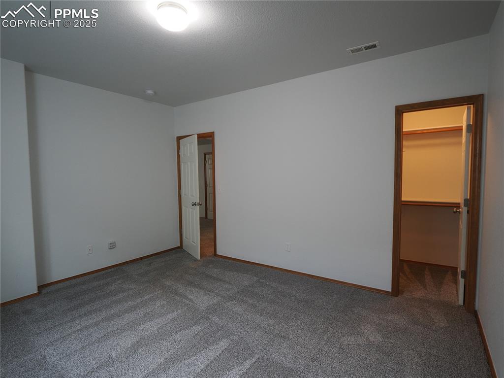 Image 41 of 49: NW basement bedroom with step in closet 