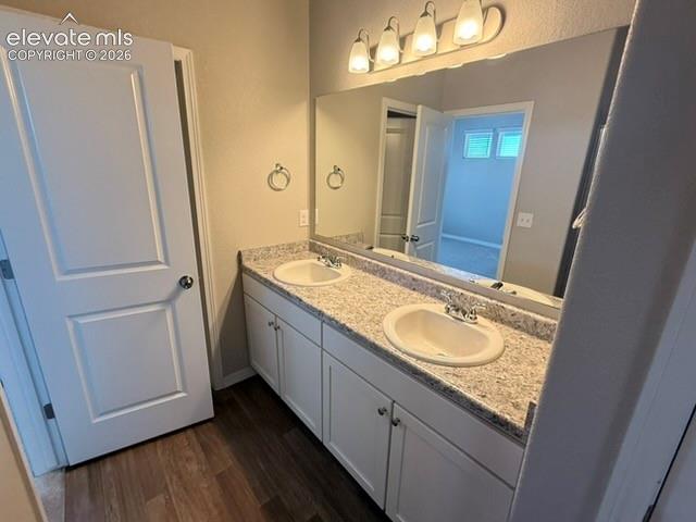 Image 14 of 42: Double vanity with light-colored countertop and two integrated sinks, set u