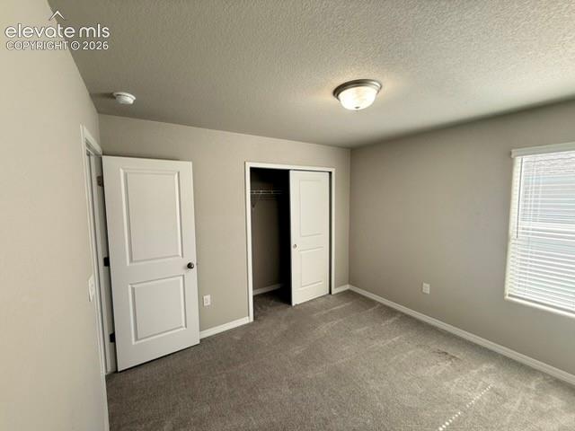 Image 27 of 42: Neutral tone wall paint, textured ceiling, flush mount ceiling light fixtur