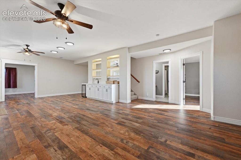 Image 21 of 36: Basement living room/ wet bar