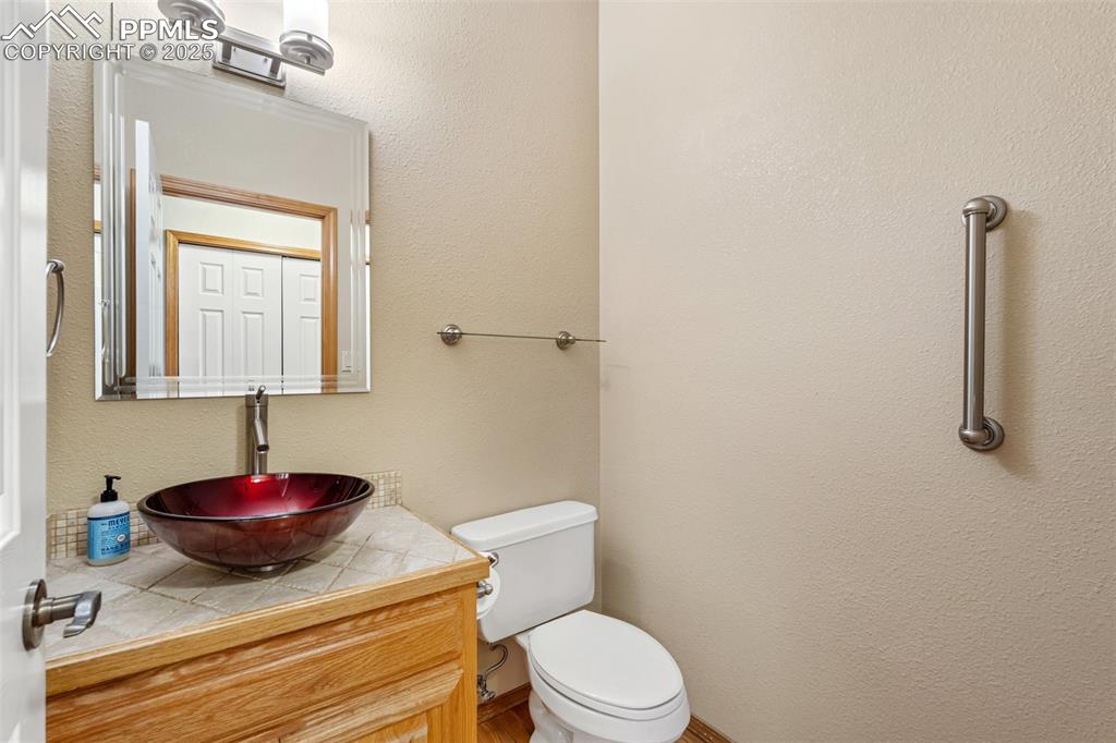 Image 16 of 48: Bathroom with vanity and toilet
