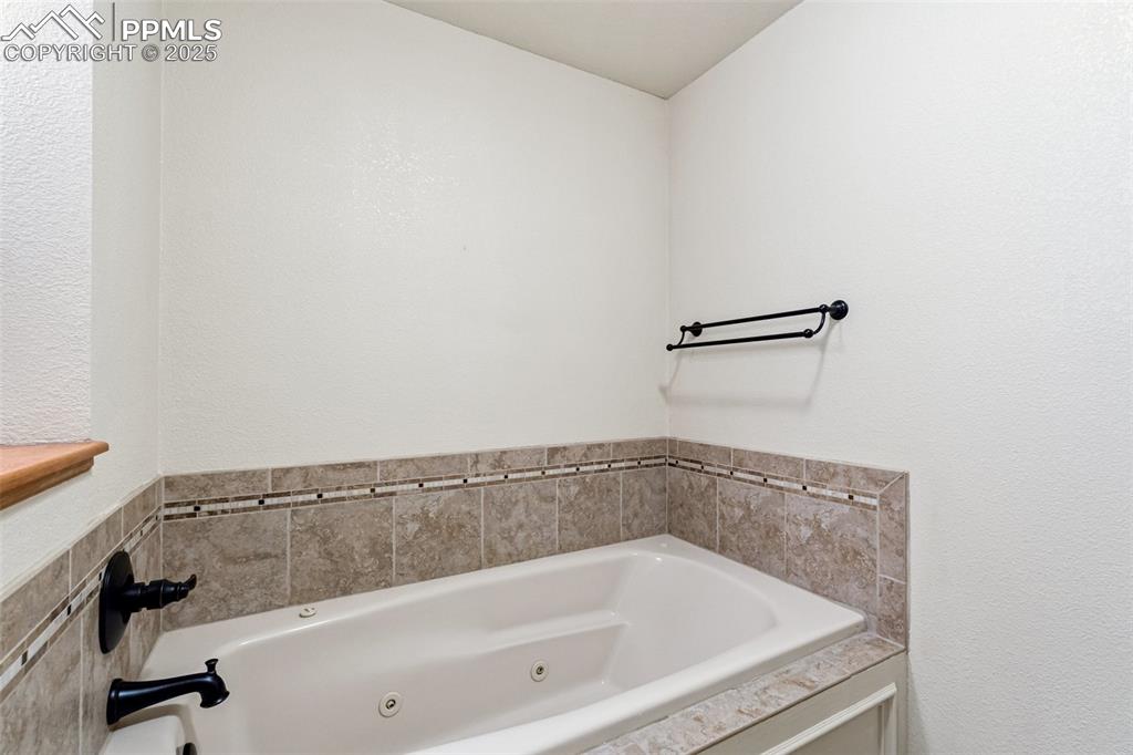 Image 22 of 48: Bathroom with a whirlpool tub