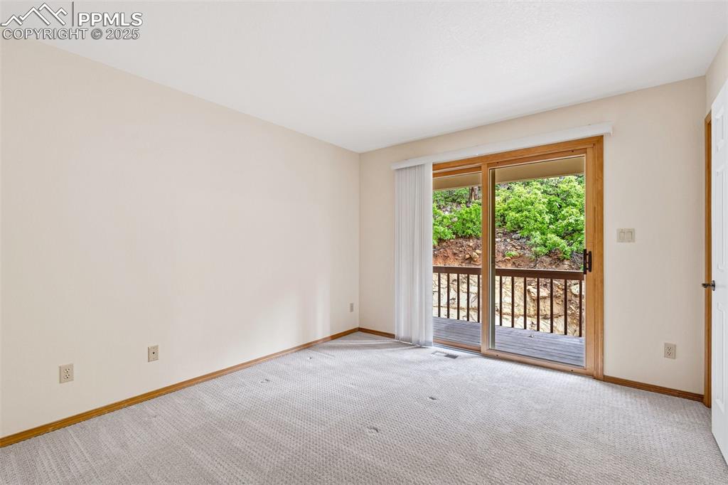 Image 36 of 48: Carpeted empty room with baseboards