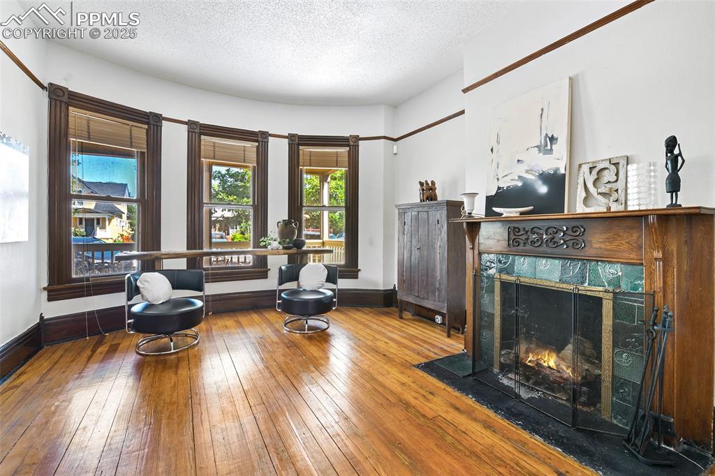 Image 10 of 42: Beautiful gas fireplace with antique tile surround