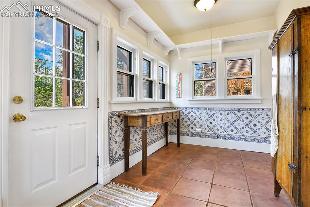 Image 19 of 42: Walk-out to garage and garden