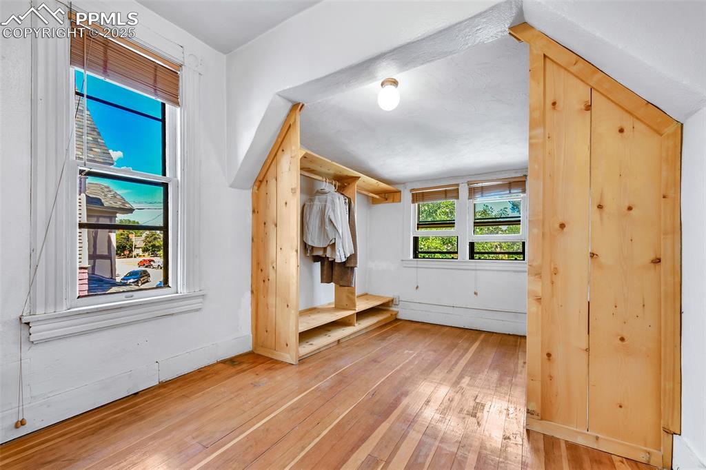 Image 24 of 42: Sunny walk-in closet off Primary Bedroom