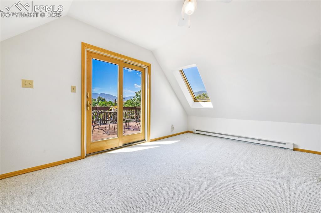 Image 34 of 42: Half-story loft at the top of the stairs would make a quiet study or game r