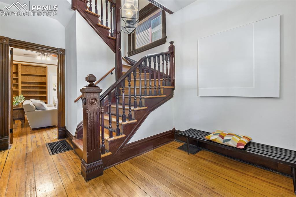 Image 5 of 42: Main-level bedroom behind foyer