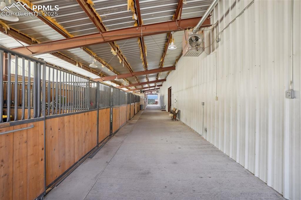 Image 36 of 49: indoor arena stall area