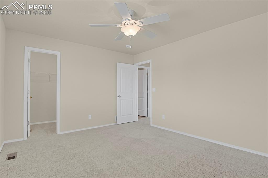 Image 33 of 41: Spacious upper level bedroom with walk-in closet