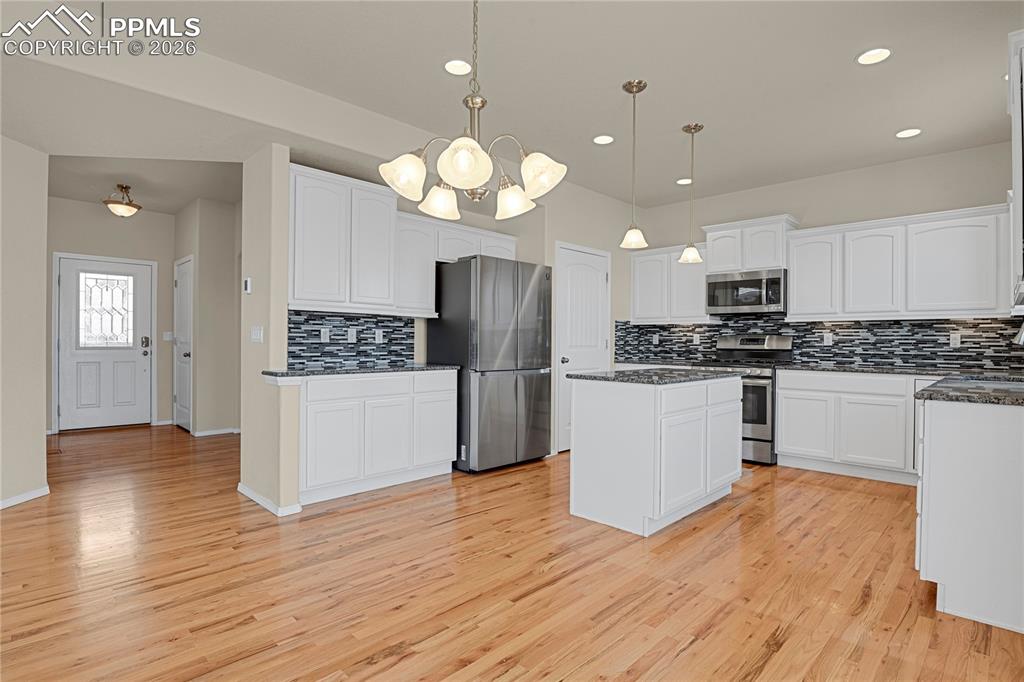Image 5 of 41: Beautiful expanded kitchen with center island