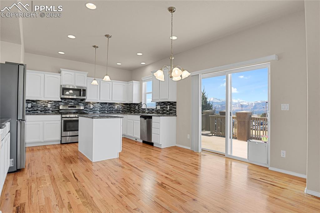 Image 8 of 41: Walk-out to back deck