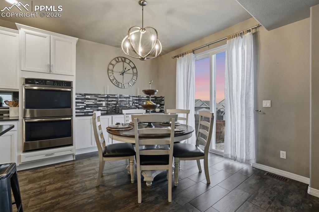 Image 10 of 49: built in buffet offers more cabinet and serving space, spacious dining area