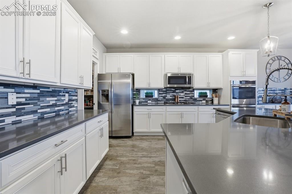 Image 13 of 49: lots of cabinet and countertop space