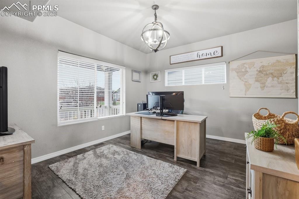 Image 17 of 49: office overlooks the front porch area and can also be converted into a bedr