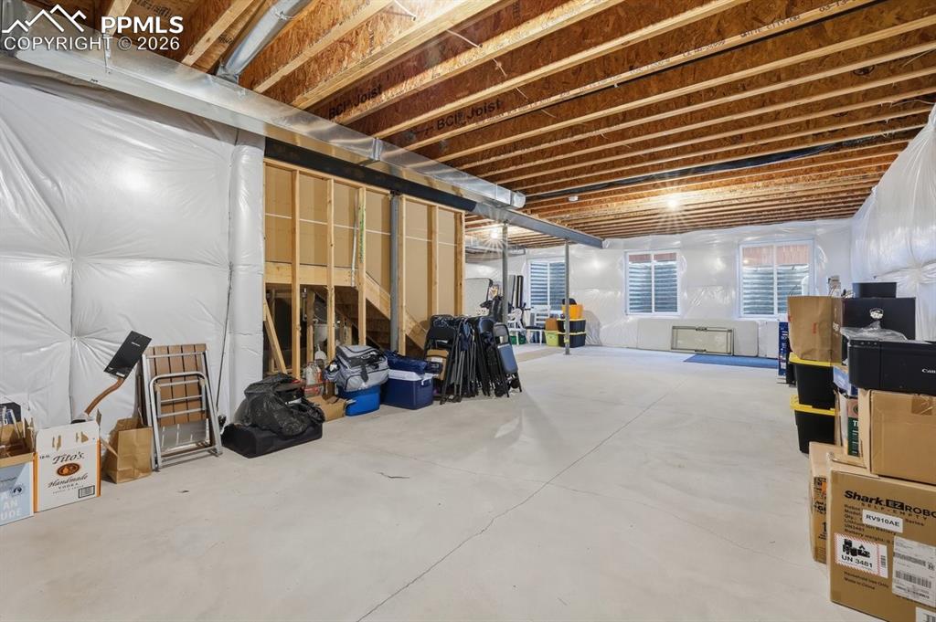 Image 38 of 49: 9 foot ceilings, pre-plumbed for future bathroom