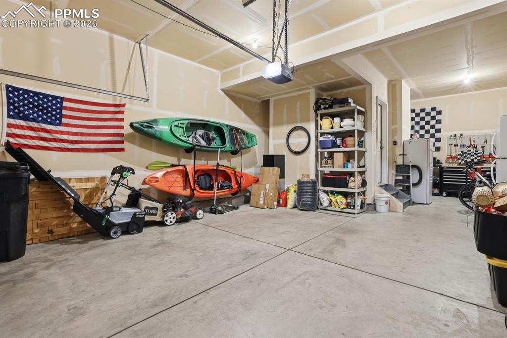 Image 39 of 49: 3 car tandem offers room for oversized vehicles and additional storage or w