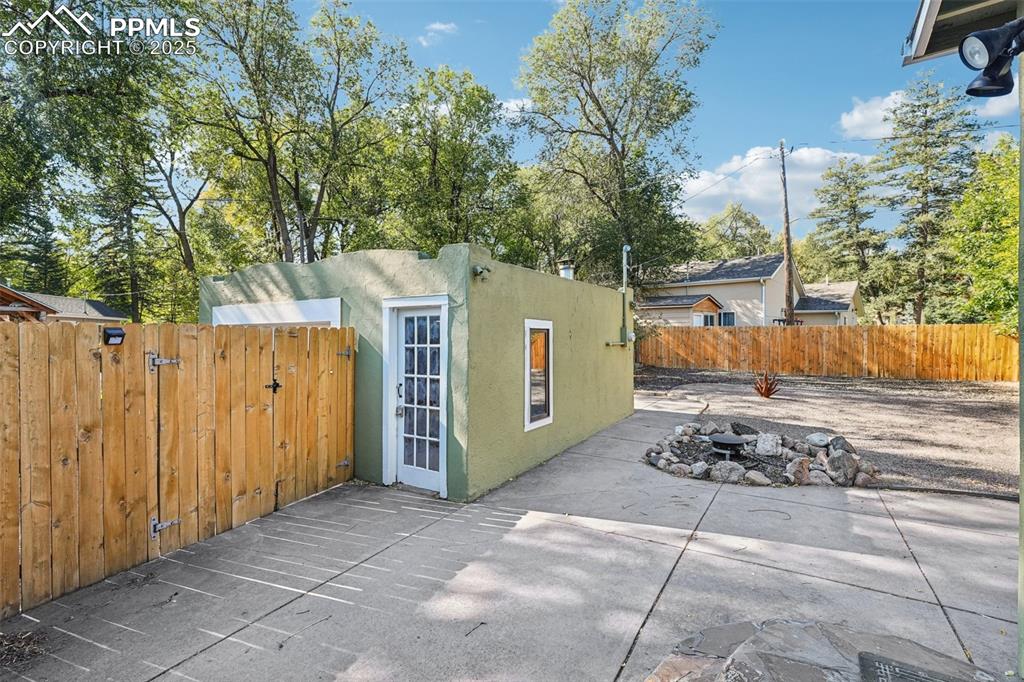 Image 30 of 36: Back patio going into the detached garage
