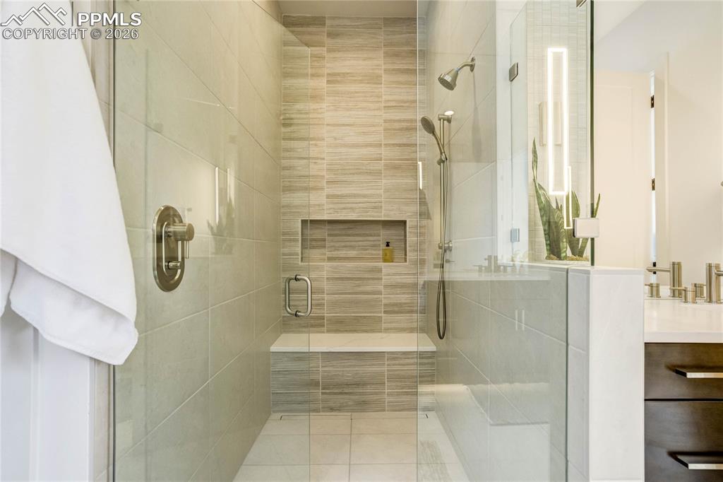 Image 21 of 50: and a Barrier-Free Mud-Set Walk-in Shower w/Linear Drain, Dual Shower Heads