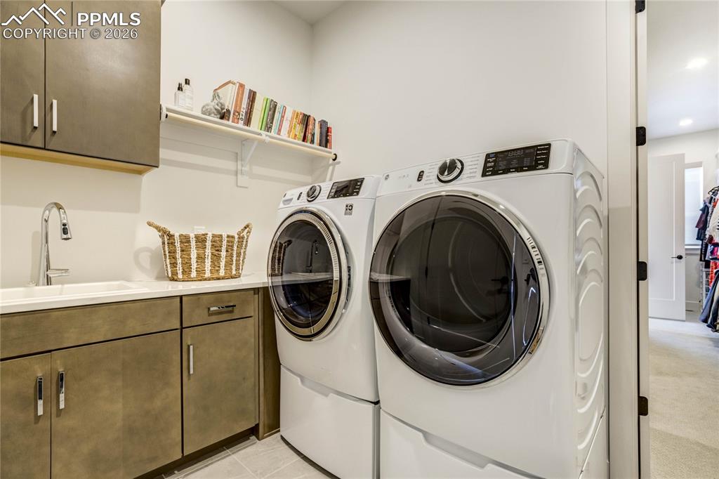 Image 22 of 50:  Designed with Intention, the Main Level Laundry Room Combines Practicality