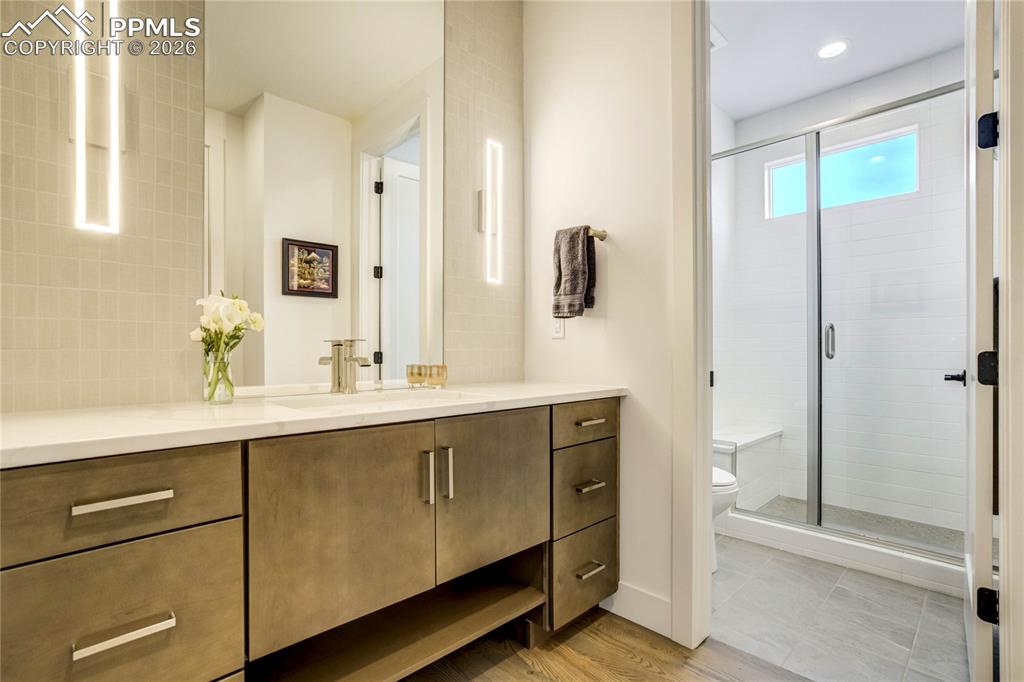 Image 25 of 50: Main Level 3/4 Bath Thoughtfully Designed with Both Form and Function in Mi