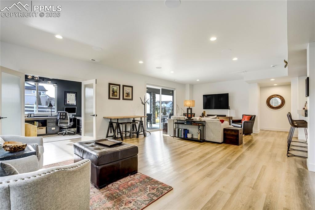 Image 27 of 50: Recreation Room Offers 9-Foot Ceilings, Abundant Natural Light, and LVP Flo