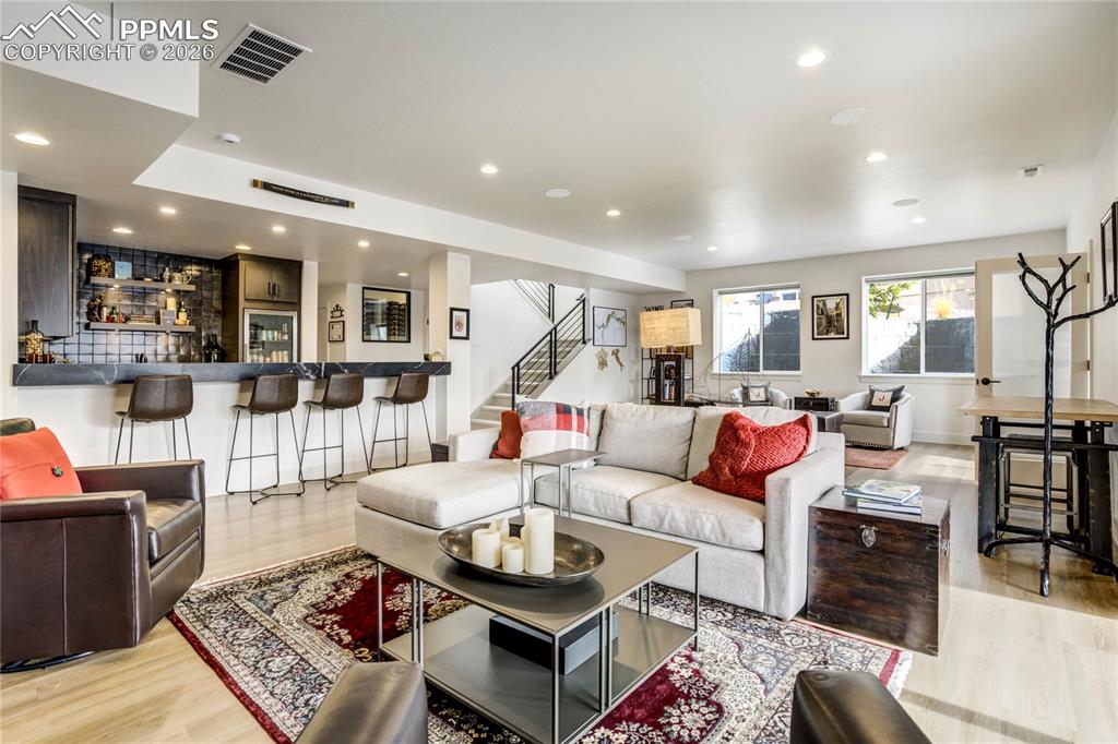 Image 28 of 50: The walk-out lower level continues the architectural narrative with 9’ ceil