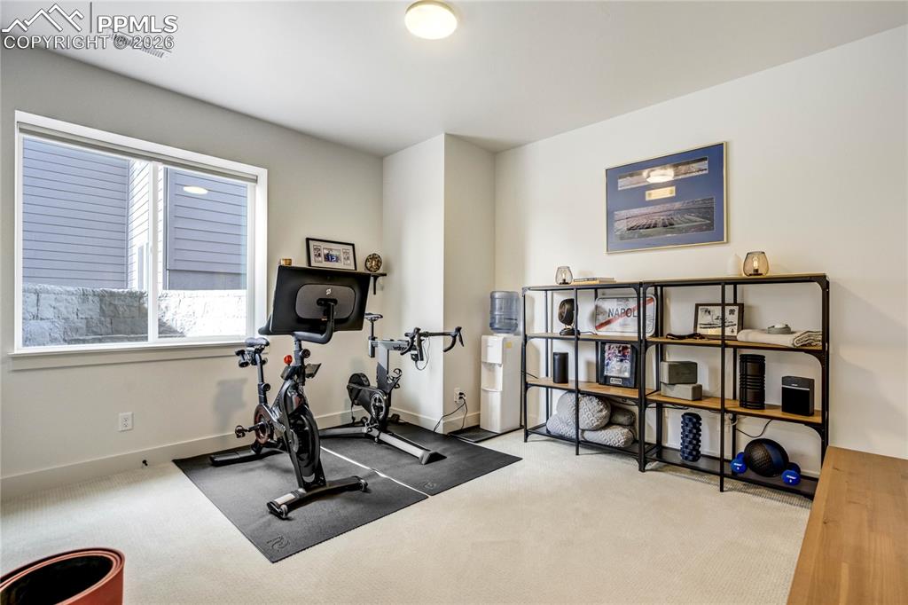 Image 34 of 50:  Bright and Versatile, the Fourth Bedroom Offers Flexible Use as Guest Acco