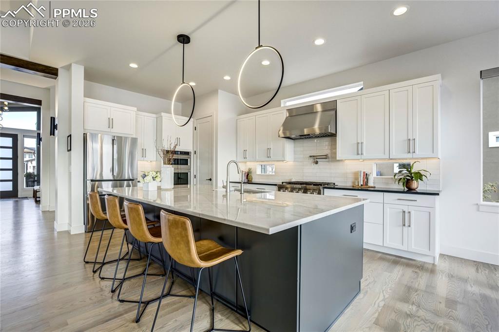 Image 5 of 50: Alder Wood Beams, 3¼” red oak floors in a Sophisticated Grey Taupe Ground t