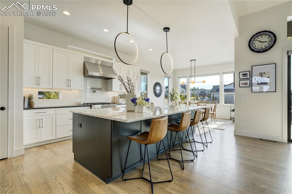 Image 7 of 50: At the Center of the Home, the Kitchen Becomes a Natural Gathering Place—Wh