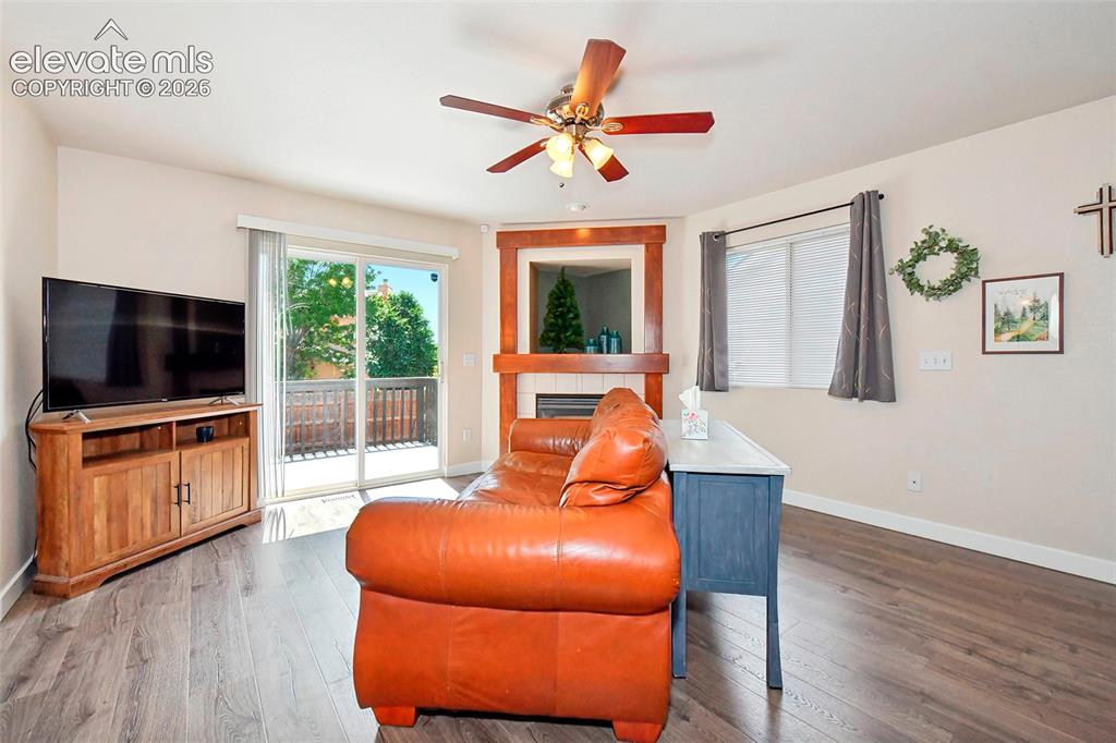 Image 11 of 26: Living room with exit out to the newer Trex deck.