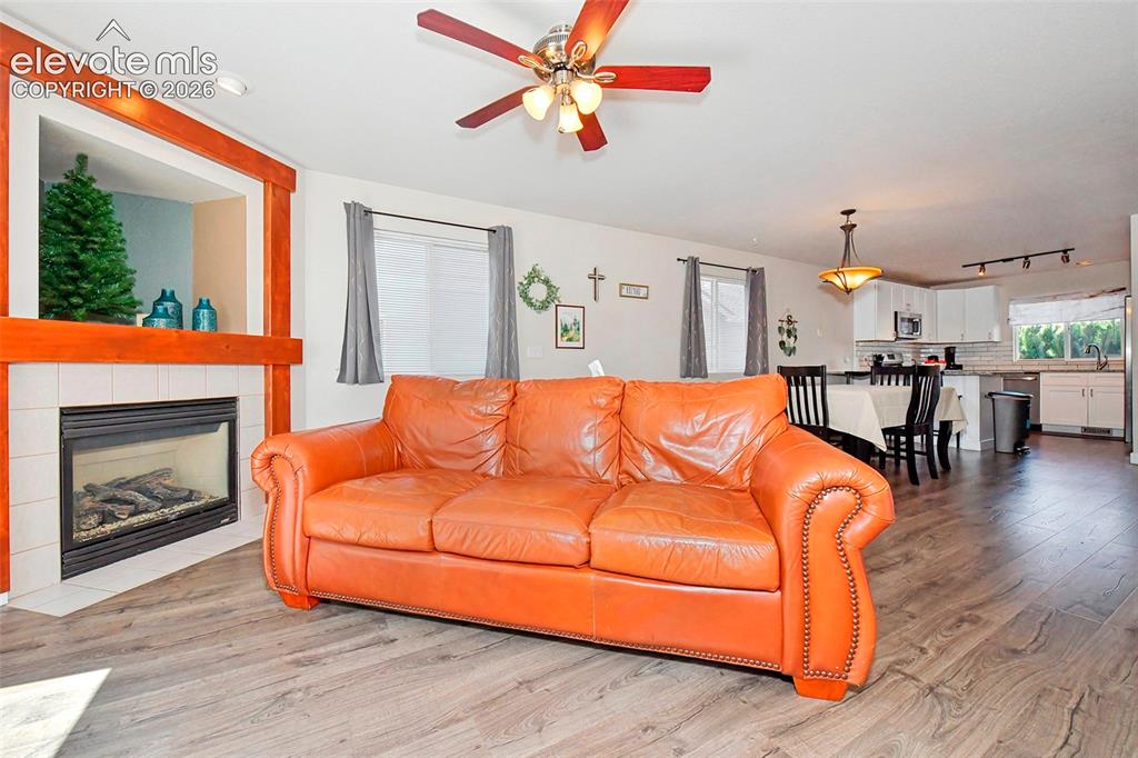 Image 12 of 26: Living room with lots of natural light.