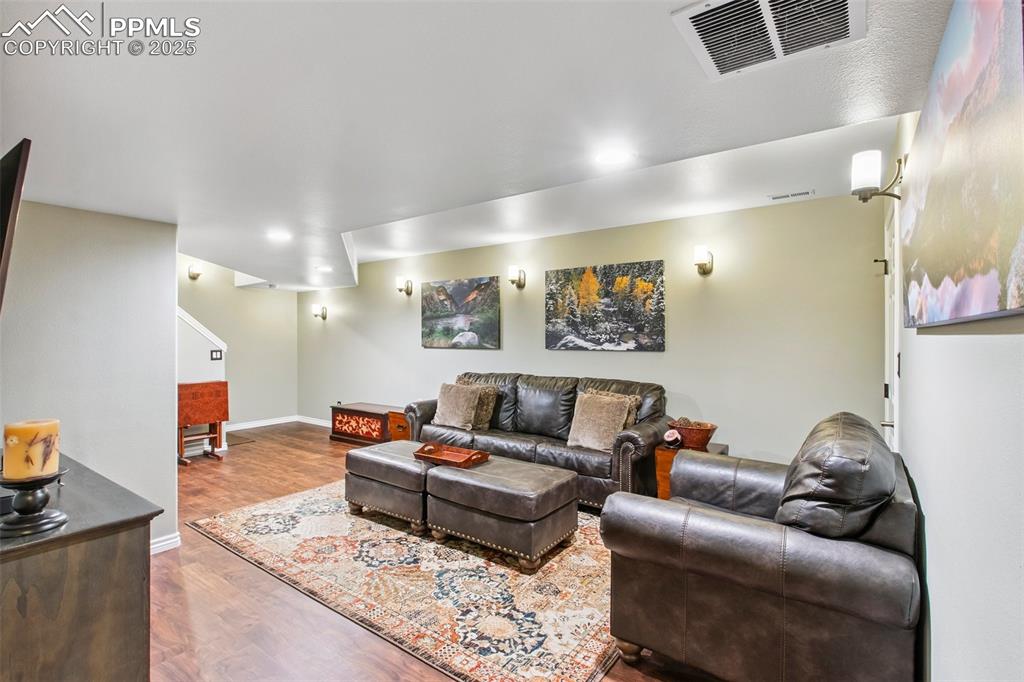Image 31 of 44: Living room with wood finished floors and baseboards