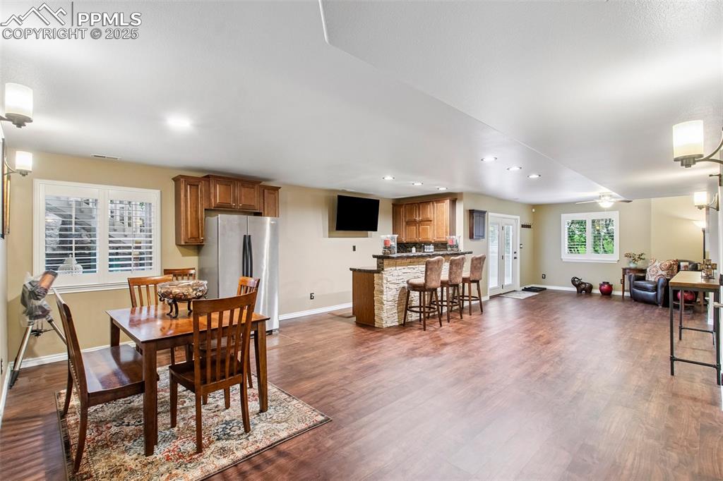 Image 33 of 44: Dining space with recessed lighting, dark wood-style flooring, and ceiling