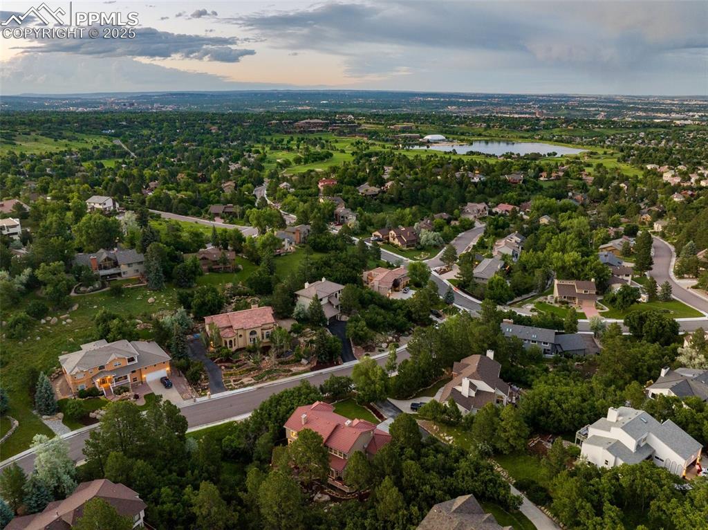 Image 43 of 44: Aerial view at dusk of a water view and a residential view