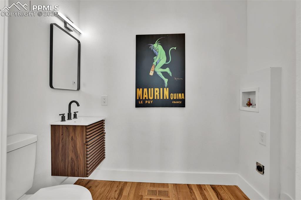 Image 14 of 49: Bathroom featuring light wood-style floors and vanity