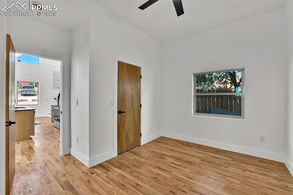 Image 17 of 49: Unfurnished bedroom featuring light wood-style flooring and a ceiling fan