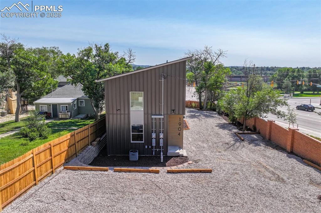 Image 42 of 49: View of outbuilding featuring a fenced backyard