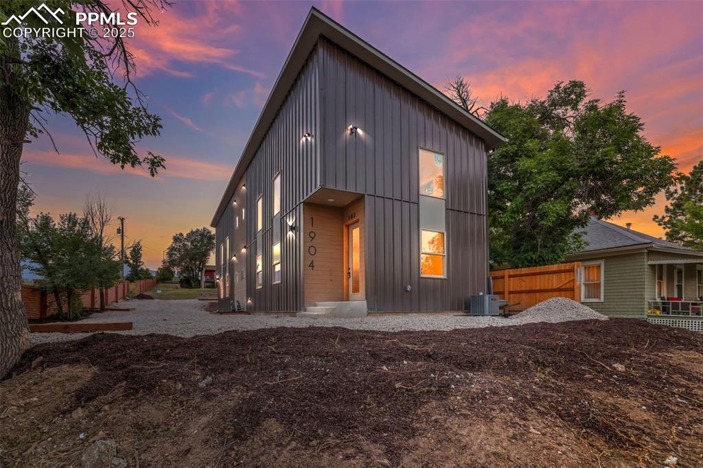 Image 49 of 49: View of front of property featuring board and batten siding