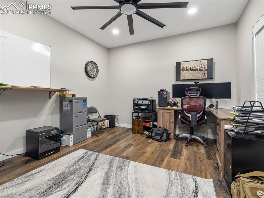 Image 27 of 48: Office area featuring ceiling fan, wood finished floors, and recessed light