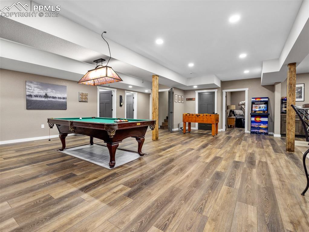 Image 40 of 48: Game room featuring wood finished floors, pool table, and recessed lighting