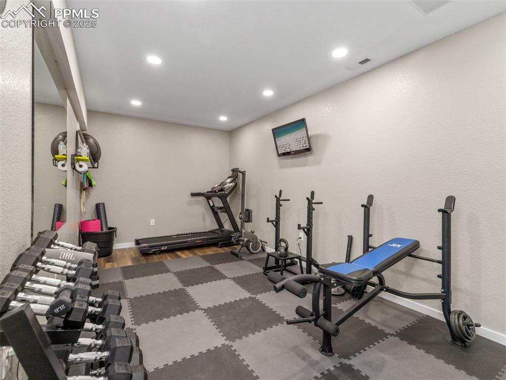 Image 46 of 48: Workout area featuring recessed lighting and baseboards