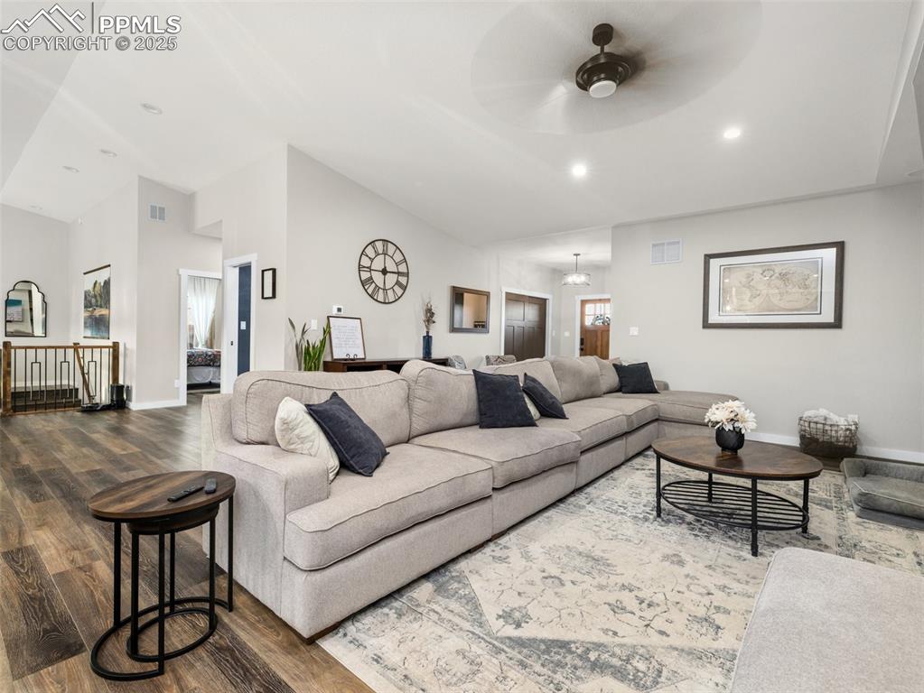 Image 7 of 48: Living room featuring wood finished floors, a ceiling fan, recessed lightin