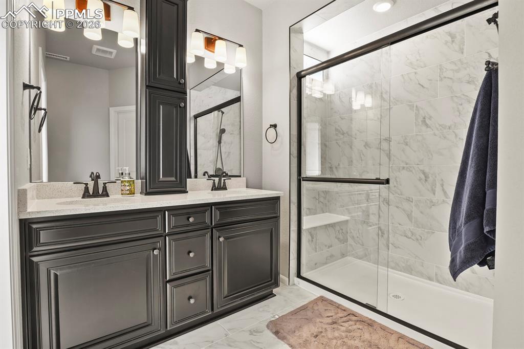 Image 19 of 27: Primary bath with oversize walk in shower.