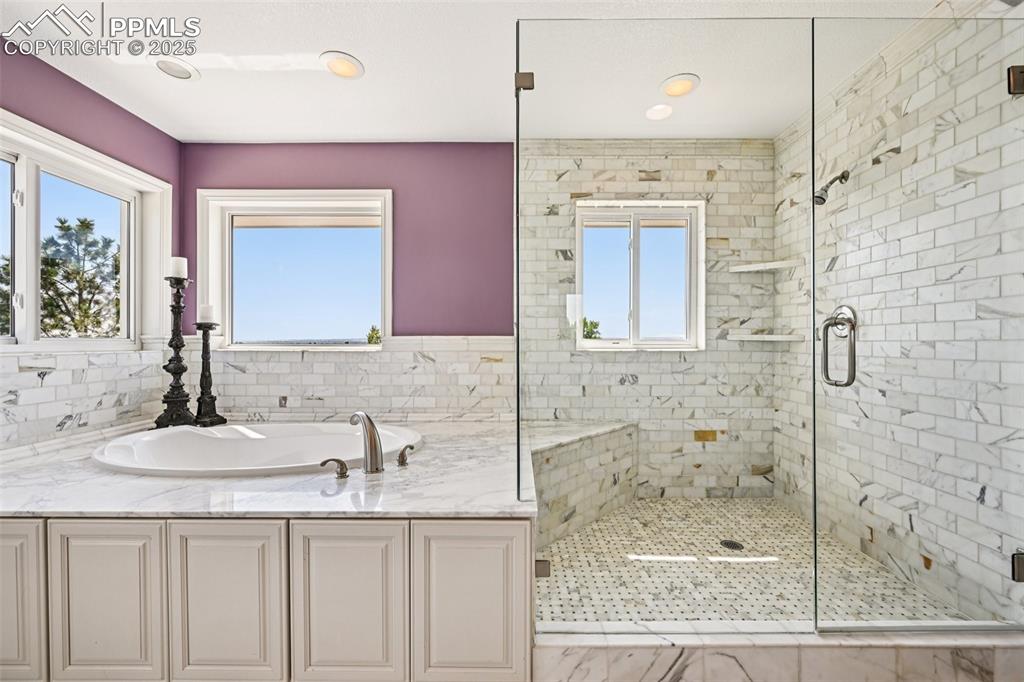 Image 33 of 50: Soaking tub and walk-in shower
