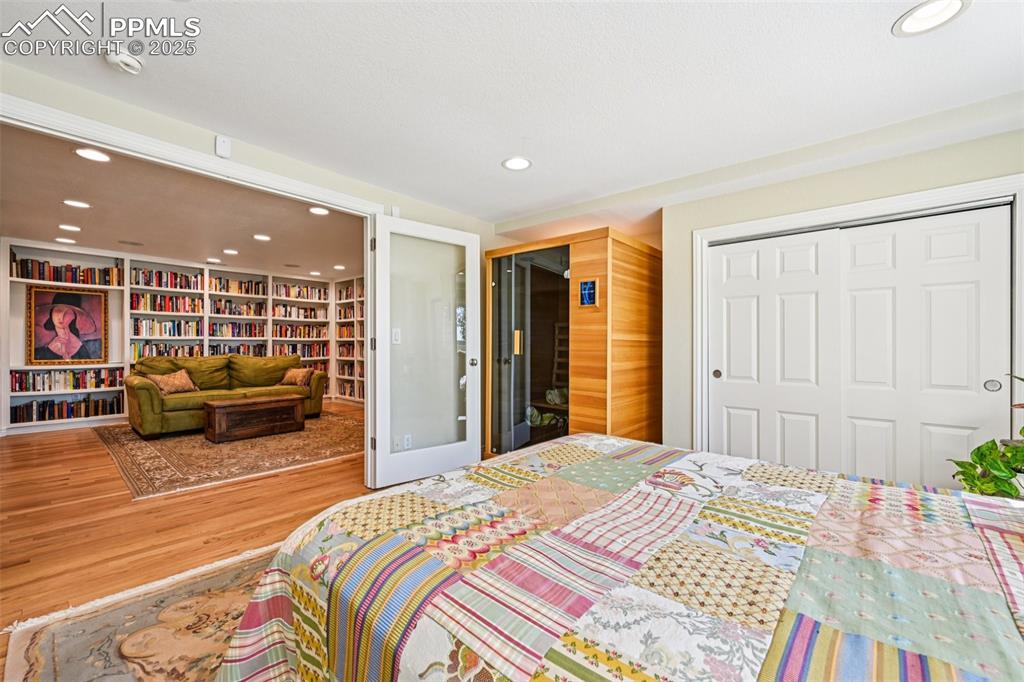 Image 42 of 50: Bedroom with French doors