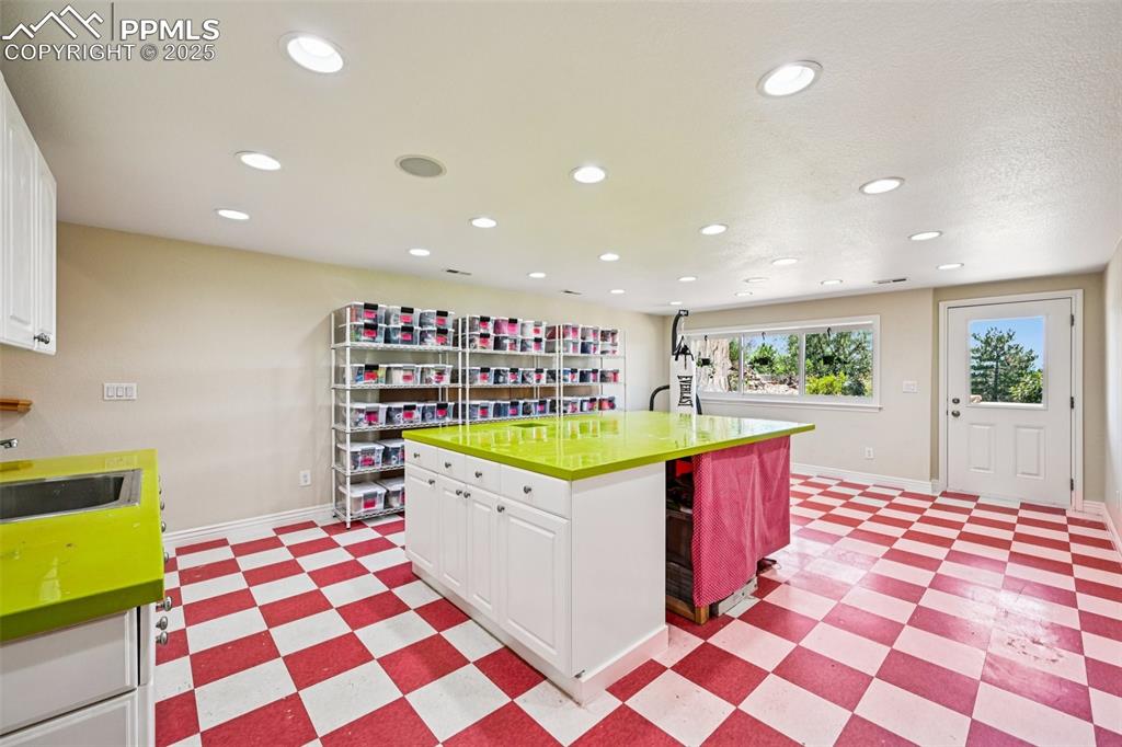 Image 44 of 50: Flexible bonus room, great as a workshop/craft room